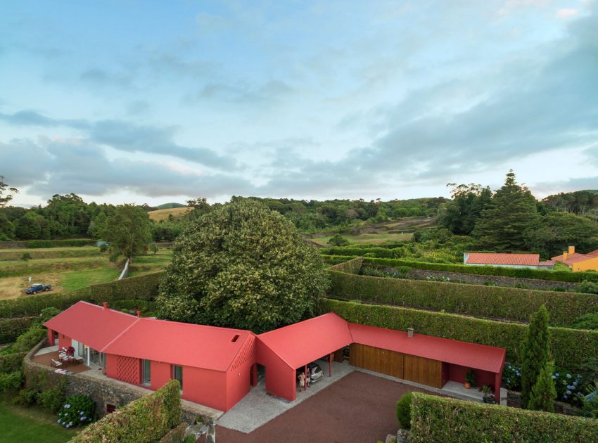 A Bright Contemporary Red Home Consists of Two Volumes Connected by a Wide Corridor in Ponta Delgada by Pedro Mauricio Borges (1)