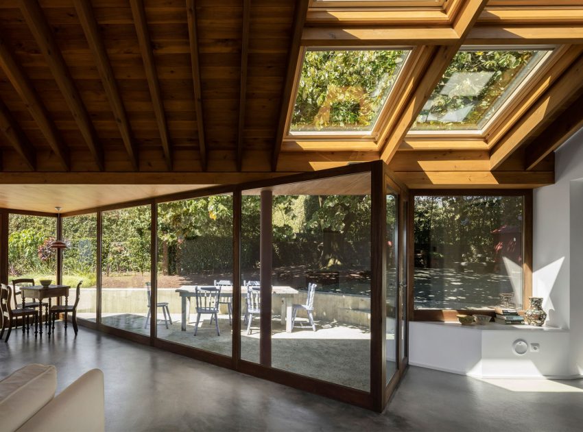 A Bright Contemporary Red Home Consists of Two Volumes Connected by a Wide Corridor in Ponta Delgada by Pedro Mauricio Borges (10)