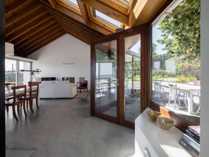 A Bright Contemporary Red Home Consists of Two Volumes Connected by a Wide Corridor in Ponta Delgada by Pedro Mauricio Borges (11)