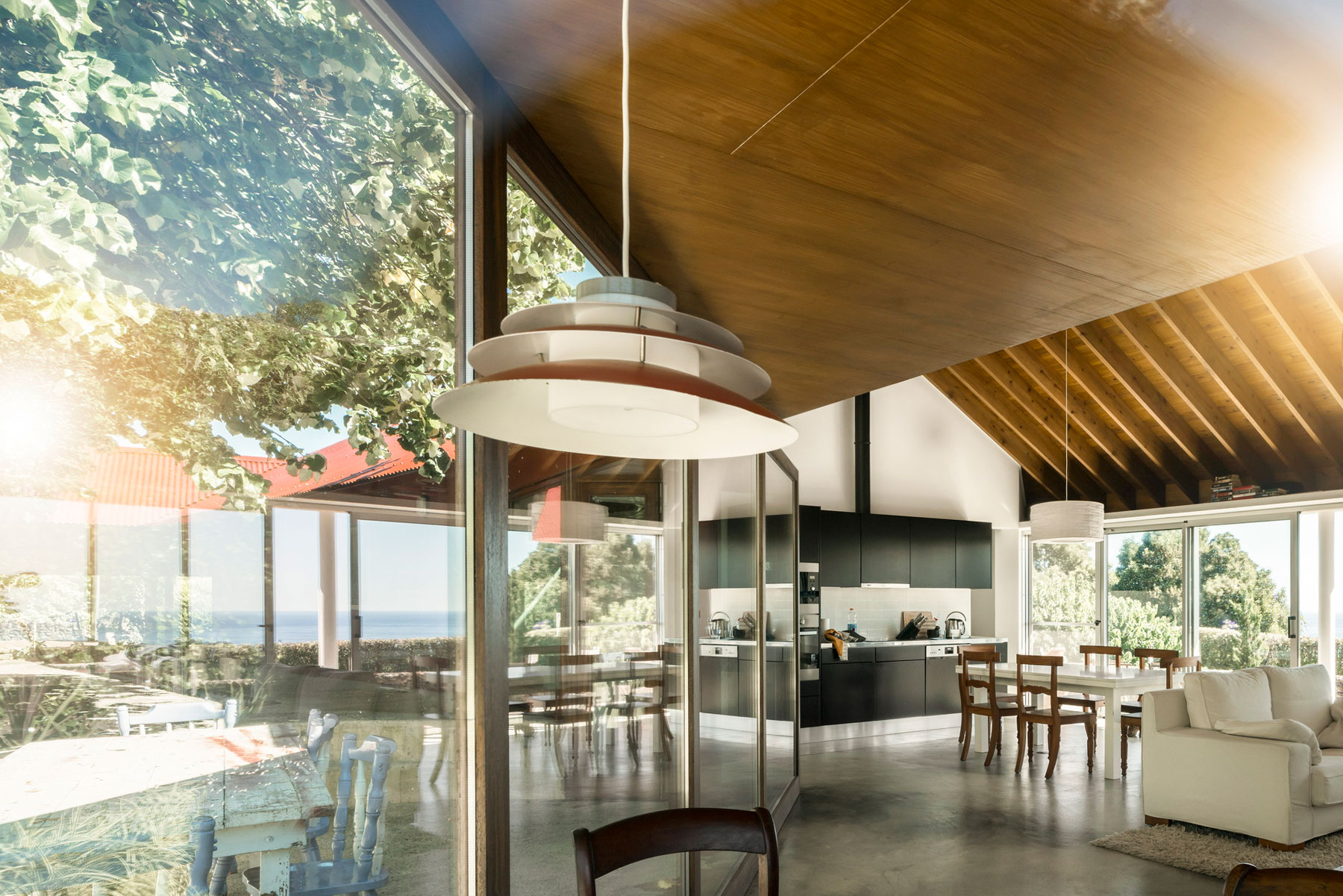 A Bright Contemporary Red Home Consists of Two Volumes Connected by a Wide Corridor in Ponta Delgada by Pedro Mauricio Borges (12)