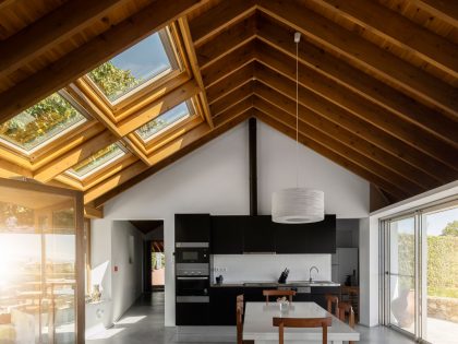 A Bright Contemporary Red Home Consists of Two Volumes Connected by a Wide Corridor in Ponta Delgada by Pedro Mauricio Borges (13)