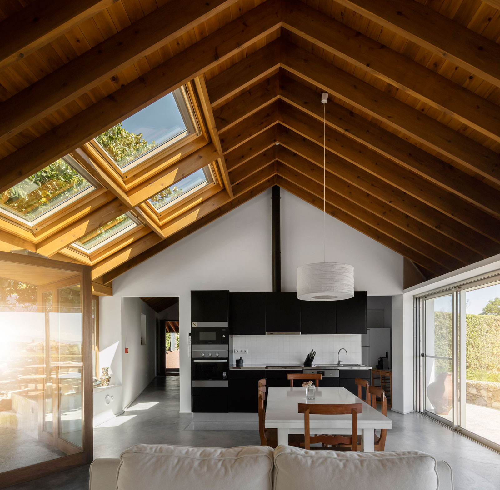 A Bright Contemporary Red Home Consists of Two Volumes Connected by a Wide Corridor in Ponta Delgada by Pedro Mauricio Borges (13)