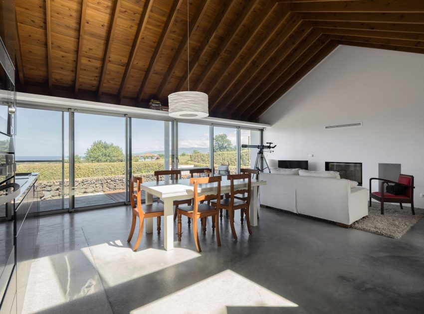 A Bright Contemporary Red Home Consists of Two Volumes Connected by a Wide Corridor in Ponta Delgada by Pedro Mauricio Borges (14)