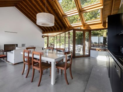 A Bright Contemporary Red Home Consists of Two Volumes Connected by a Wide Corridor in Ponta Delgada by Pedro Mauricio Borges (15)