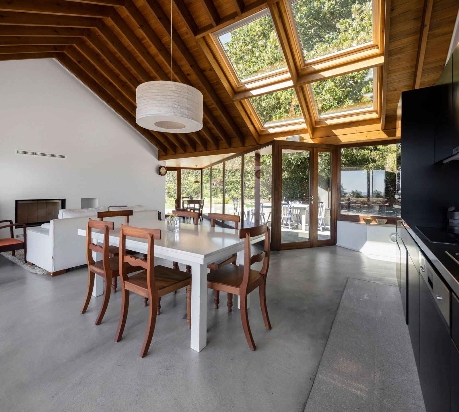 A Bright Contemporary Red Home Consists of Two Volumes Connected by a Wide Corridor in Ponta Delgada by Pedro Mauricio Borges (15)
