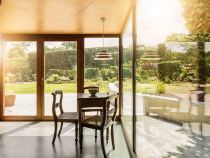 A Bright Contemporary Red Home Consists of Two Volumes Connected by a Wide Corridor in Ponta Delgada by Pedro Mauricio Borges (16)