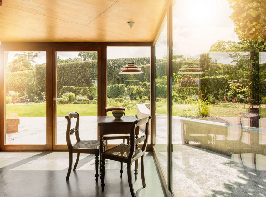 A Bright Contemporary Red Home Consists of Two Volumes Connected by a Wide Corridor in Ponta Delgada by Pedro Mauricio Borges (16)