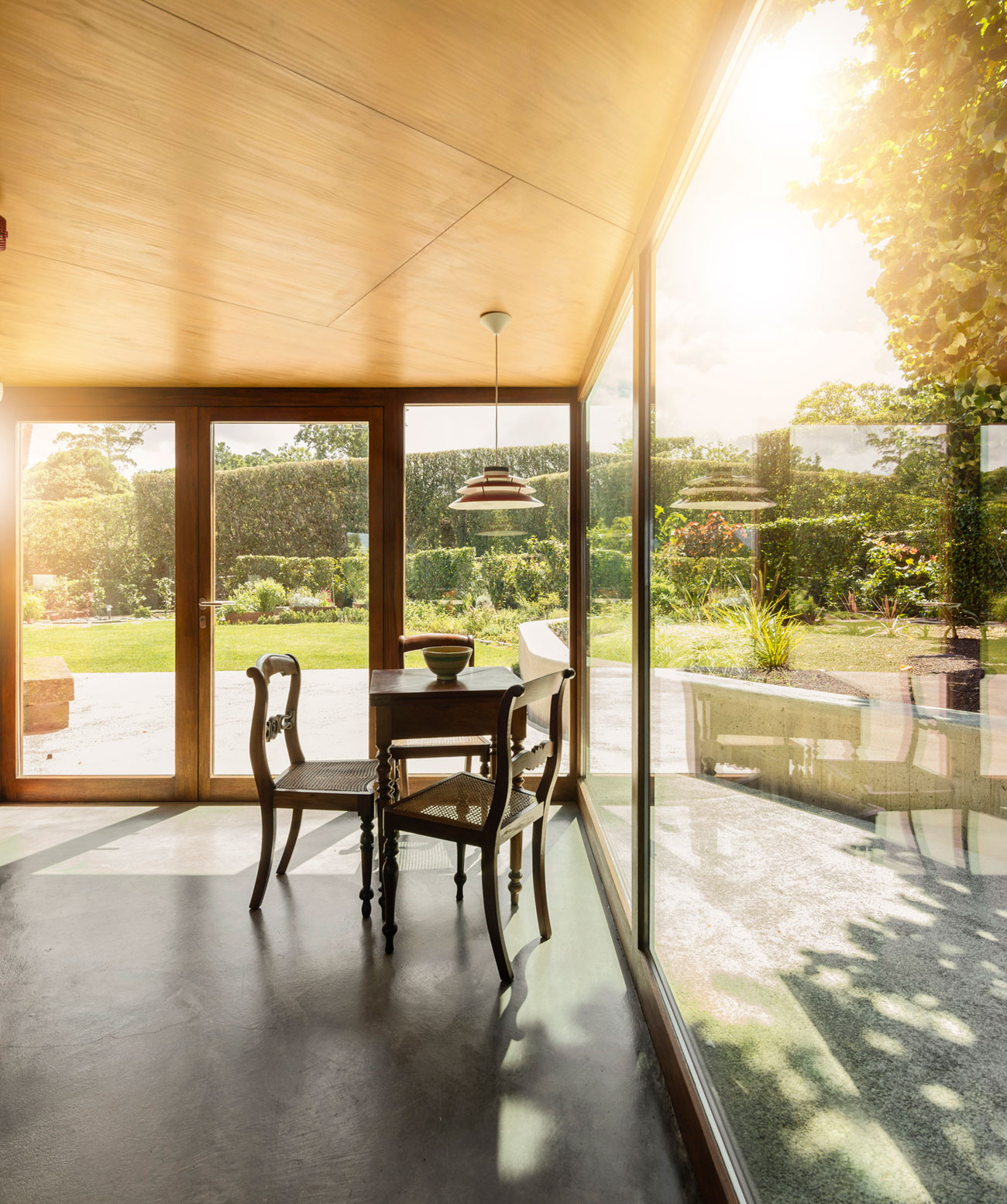 A Bright Contemporary Red Home Consists of Two Volumes Connected by a Wide Corridor in Ponta Delgada by Pedro Mauricio Borges (16)
