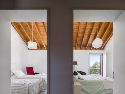 A Bright Contemporary Red Home Consists of Two Volumes Connected by a Wide Corridor in Ponta Delgada by Pedro Mauricio Borges (17)