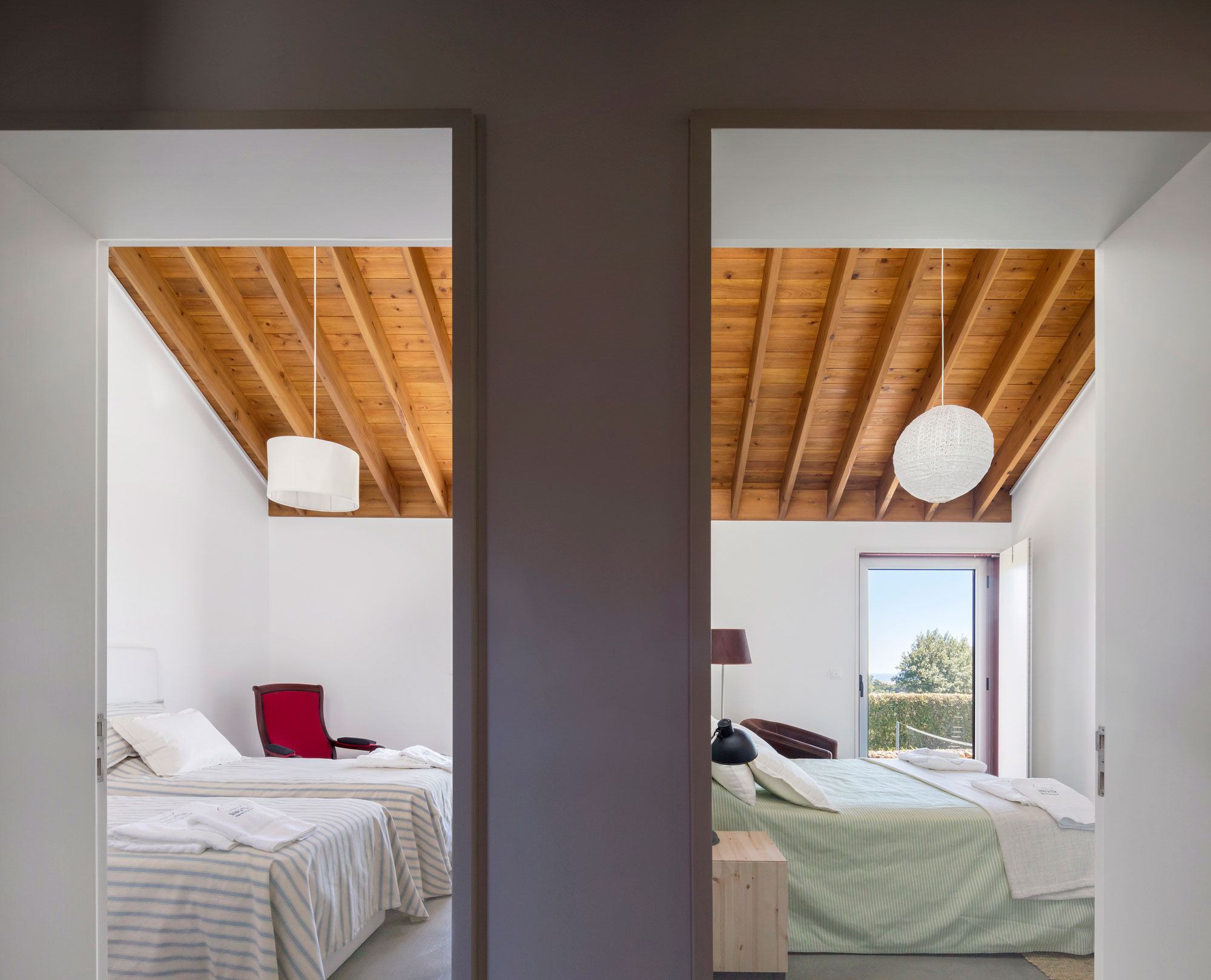 A Bright Contemporary Red Home Consists of Two Volumes Connected by a Wide Corridor in Ponta Delgada by Pedro Mauricio Borges (17)