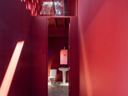 A Bright Contemporary Red Home Consists of Two Volumes Connected by a Wide Corridor in Ponta Delgada by Pedro Mauricio Borges (18)