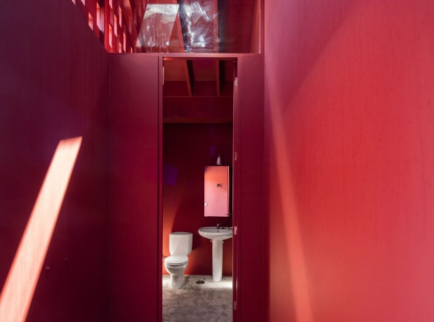A Bright Contemporary Red Home Consists of Two Volumes Connected by a Wide Corridor in Ponta Delgada by Pedro Mauricio Borges (18)