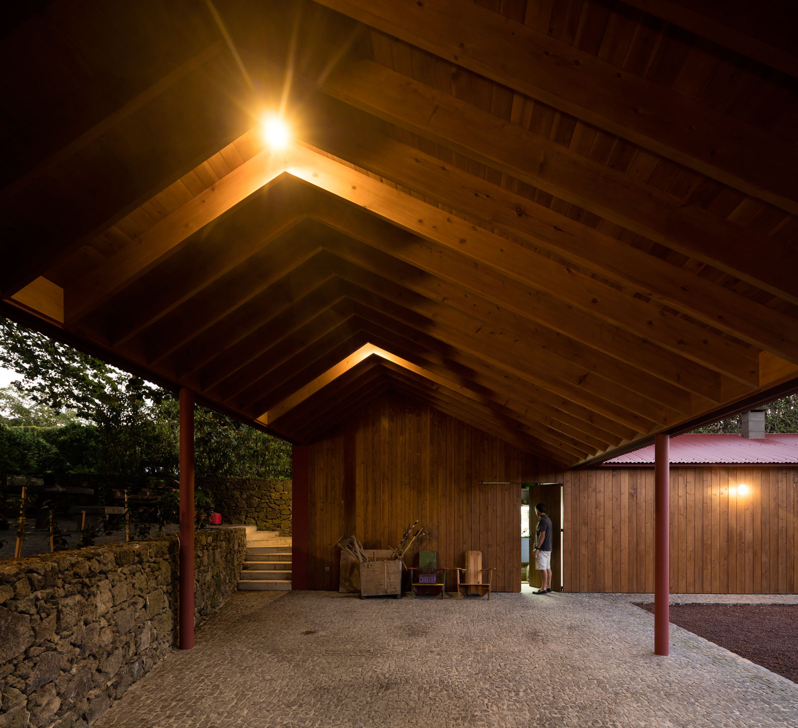 A Bright Contemporary Red Home Consists of Two Volumes Connected by a Wide Corridor in Ponta Delgada by Pedro Mauricio Borges (19)