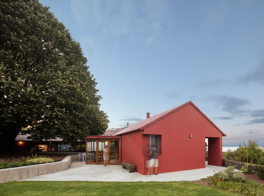 A Bright Contemporary Red Home Consists of Two Volumes Connected by a Wide Corridor in Ponta Delgada by Pedro Mauricio Borges (2)