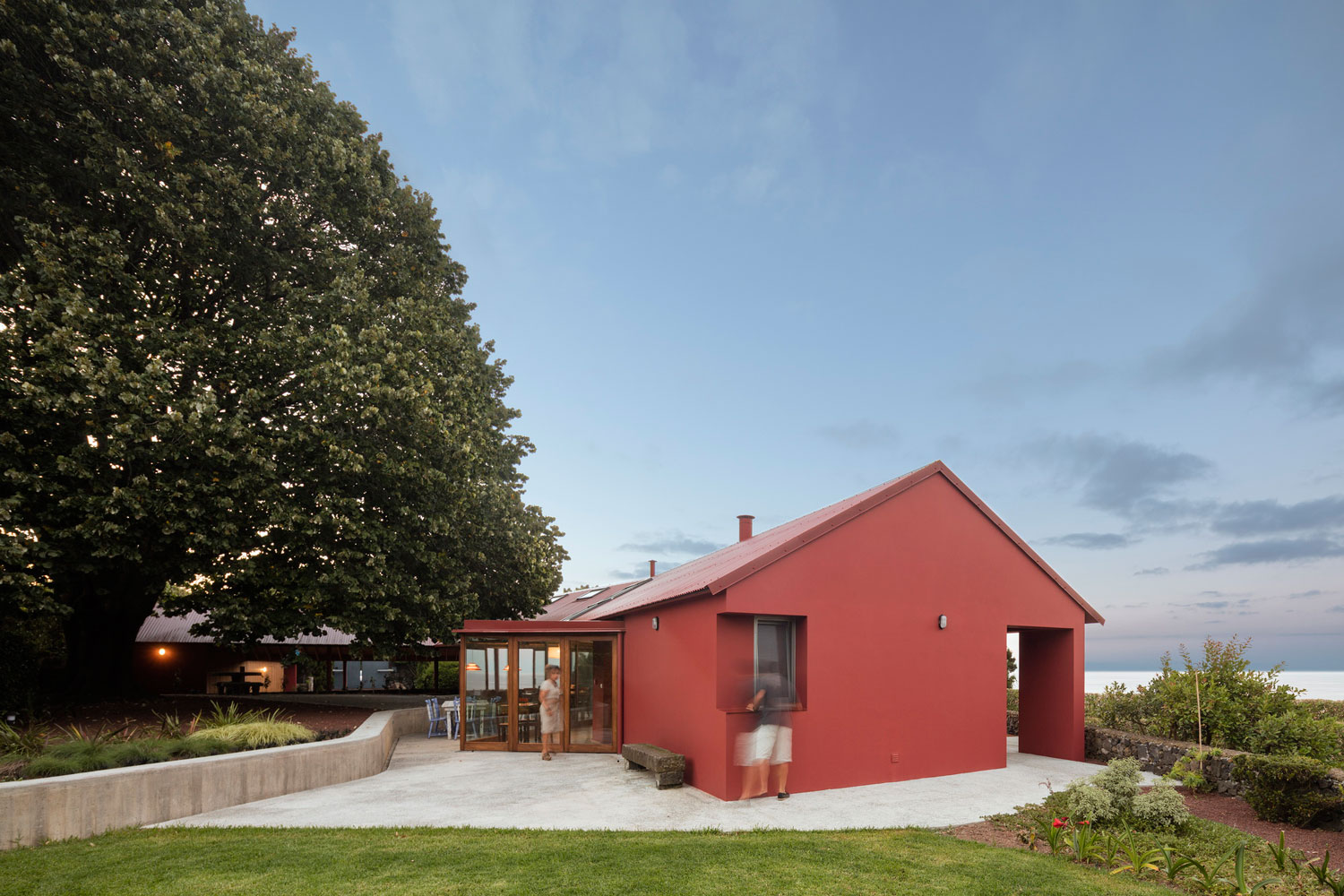 A Bright Contemporary Red Home Consists of Two Volumes Connected by a Wide Corridor in Ponta Delgada by Pedro Mauricio Borges (2)