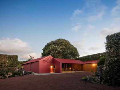 A Bright Contemporary Red Home Consists of Two Volumes Connected by a Wide Corridor in Ponta Delgada by Pedro Mauricio Borges (21)