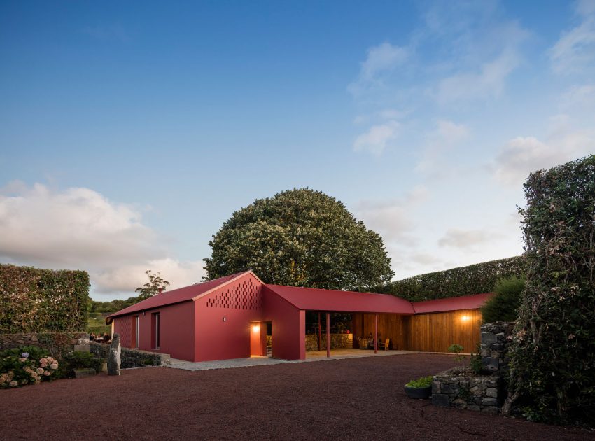 A Bright Contemporary Red Home Consists of Two Volumes Connected by a Wide Corridor in Ponta Delgada by Pedro Mauricio Borges (21)