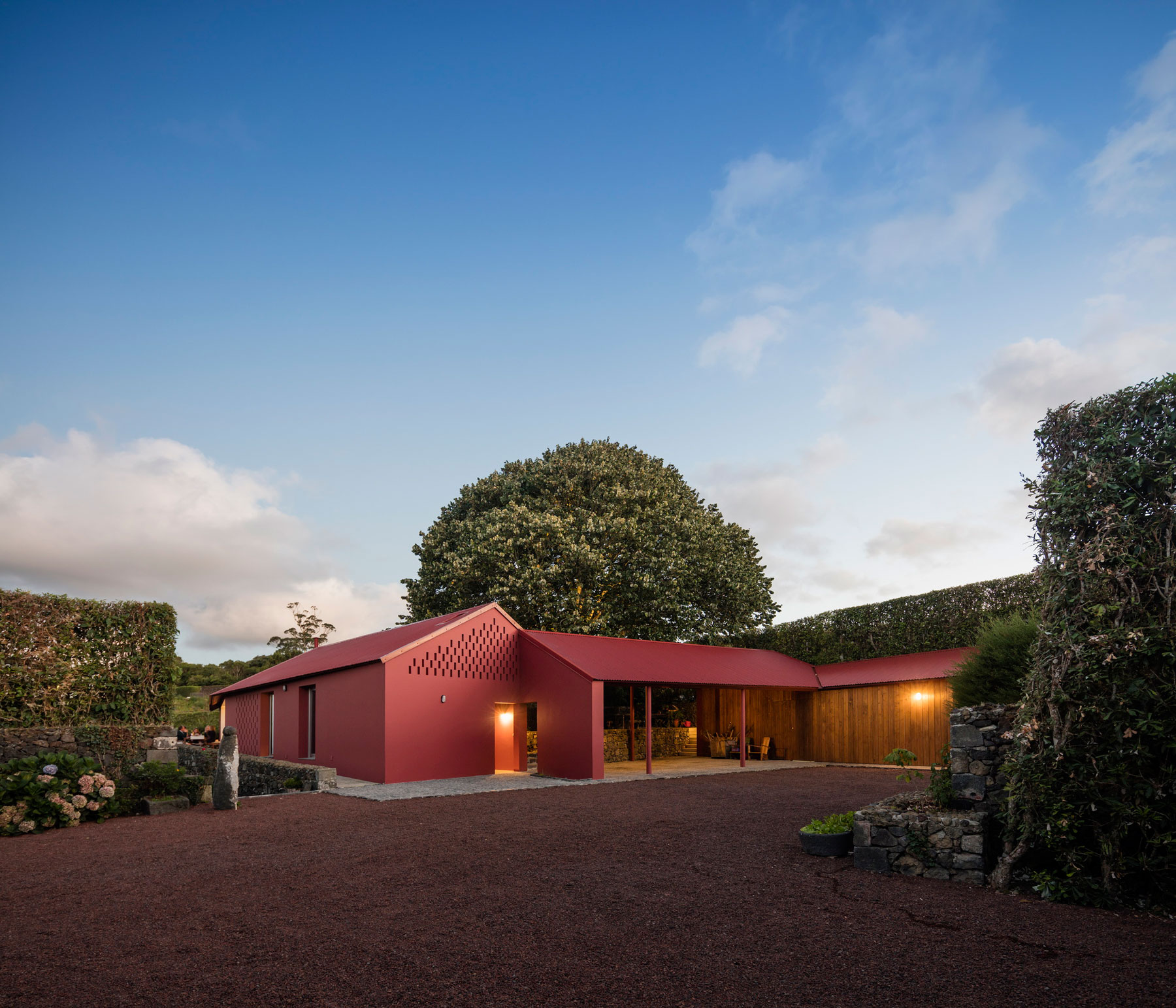 A Bright Contemporary Red Home Consists of Two Volumes Connected by a Wide Corridor in Ponta Delgada by Pedro Mauricio Borges (21)