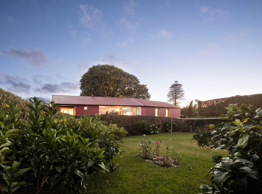 A Bright Contemporary Red Home Consists of Two Volumes Connected by a Wide Corridor in Ponta Delgada by Pedro Mauricio Borges (22)