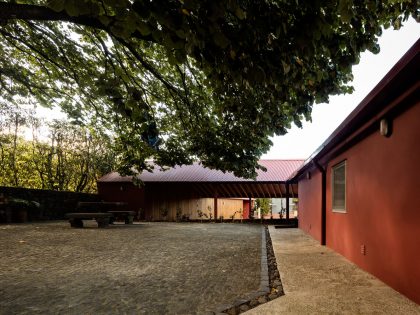 A Bright Contemporary Red Home Consists of Two Volumes Connected by a Wide Corridor in Ponta Delgada by Pedro Mauricio Borges (3)