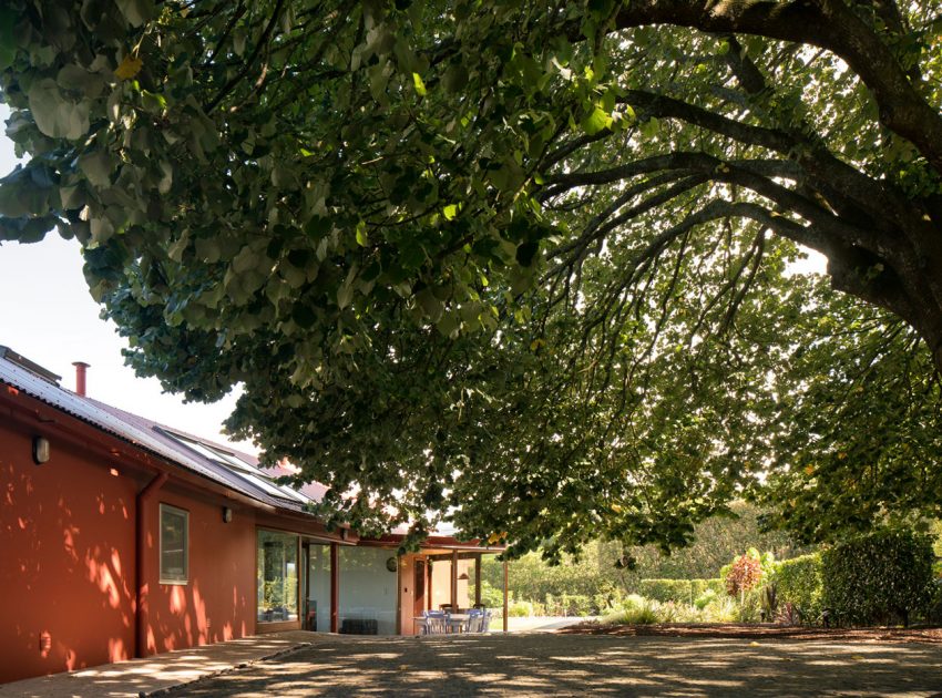 A Bright Contemporary Red Home Consists of Two Volumes Connected by a Wide Corridor in Ponta Delgada by Pedro Mauricio Borges (5)