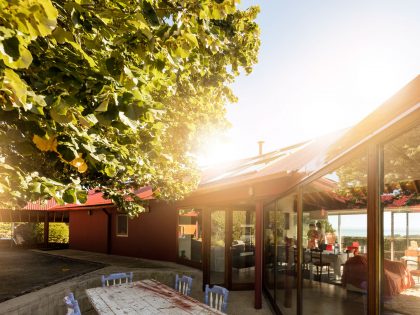 A Bright Contemporary Red Home Consists of Two Volumes Connected by a Wide Corridor in Ponta Delgada by Pedro Mauricio Borges (7)