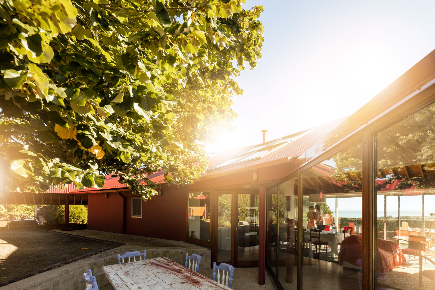 A Bright Contemporary Red Home Consists of Two Volumes Connected by a Wide Corridor in Ponta Delgada by Pedro Mauricio Borges (7)