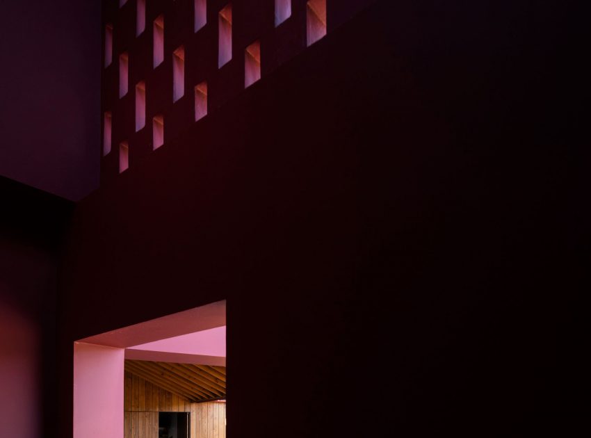 A Bright Contemporary Red Home Consists of Two Volumes Connected by a Wide Corridor in Ponta Delgada by Pedro Mauricio Borges (9)