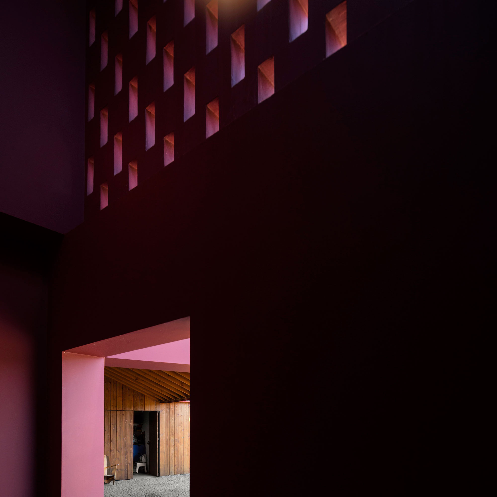 A Bright Contemporary Red Home Consists of Two Volumes Connected by a Wide Corridor in Ponta Delgada by Pedro Mauricio Borges (9)