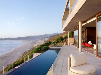 A Colorful and Vibrant Beach House Set on a Steeply Hillside in Cachagua, Chile