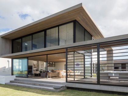 A Contemporary Family Home Greeted by a Double Height Entryway in Omaha, New Zealand by Julian Guthrie (1)