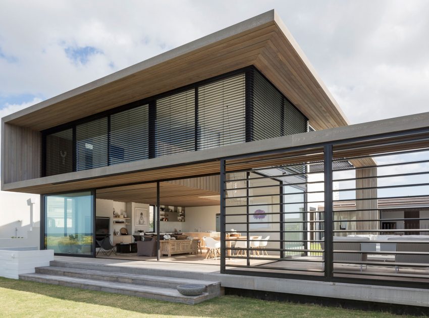 A Contemporary Family Home Greeted by a Double Height Entryway in Omaha, New Zealand by Julian Guthrie (1)