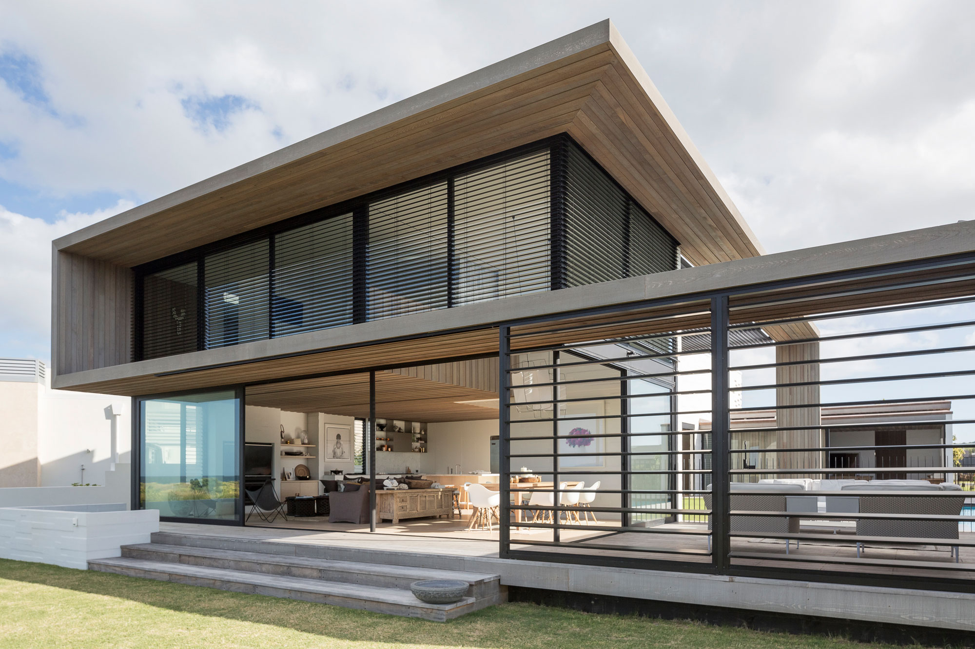 A Contemporary Family Home Greeted by a Double Height Entryway in Omaha, New Zealand by Julian Guthrie (1)