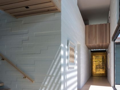 A Contemporary Family Home Greeted by a Double Height Entryway in Omaha, New Zealand by Julian Guthrie (20)