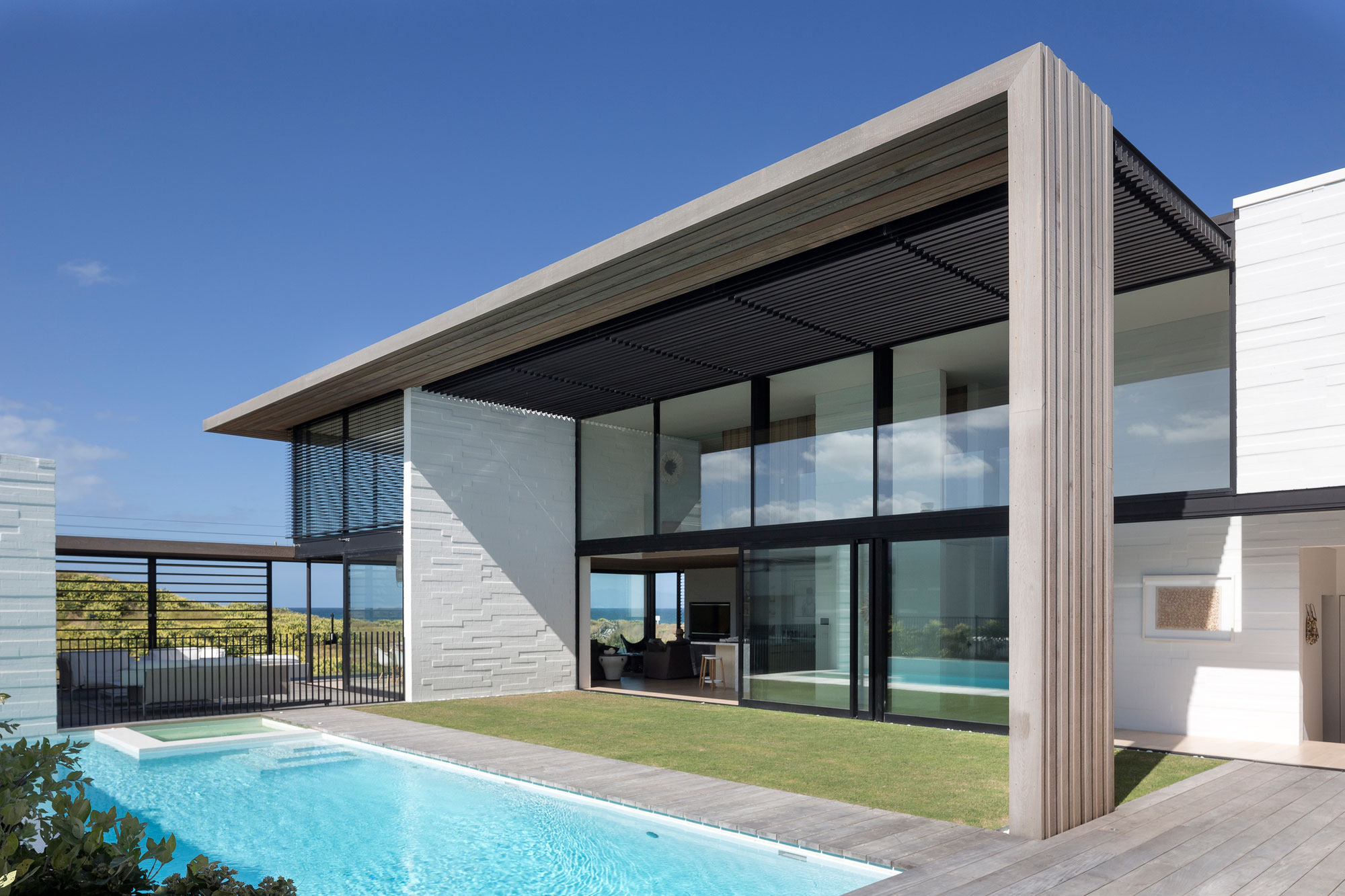 A Contemporary Family Home Greeted by a Double Height Entryway in Omaha, New Zealand by Julian Guthrie (5)