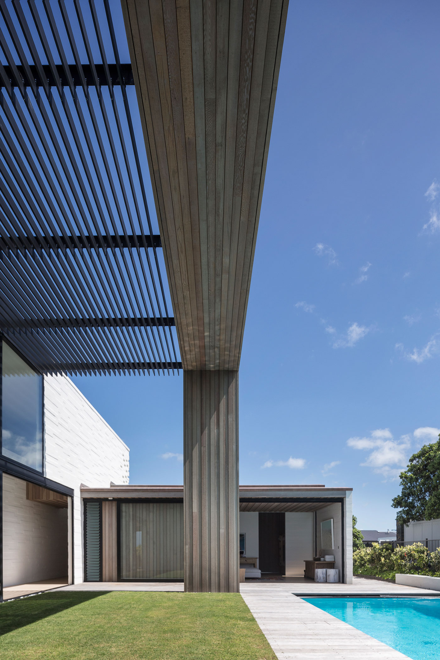 A Contemporary Family Home Greeted by a Double Height Entryway in Omaha, New Zealand by Julian Guthrie (7)