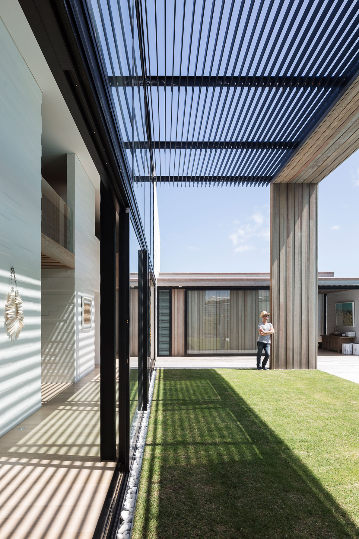 A Contemporary Family Home Greeted by a Double Height Entryway in Omaha, New Zealand by Julian Guthrie (8)