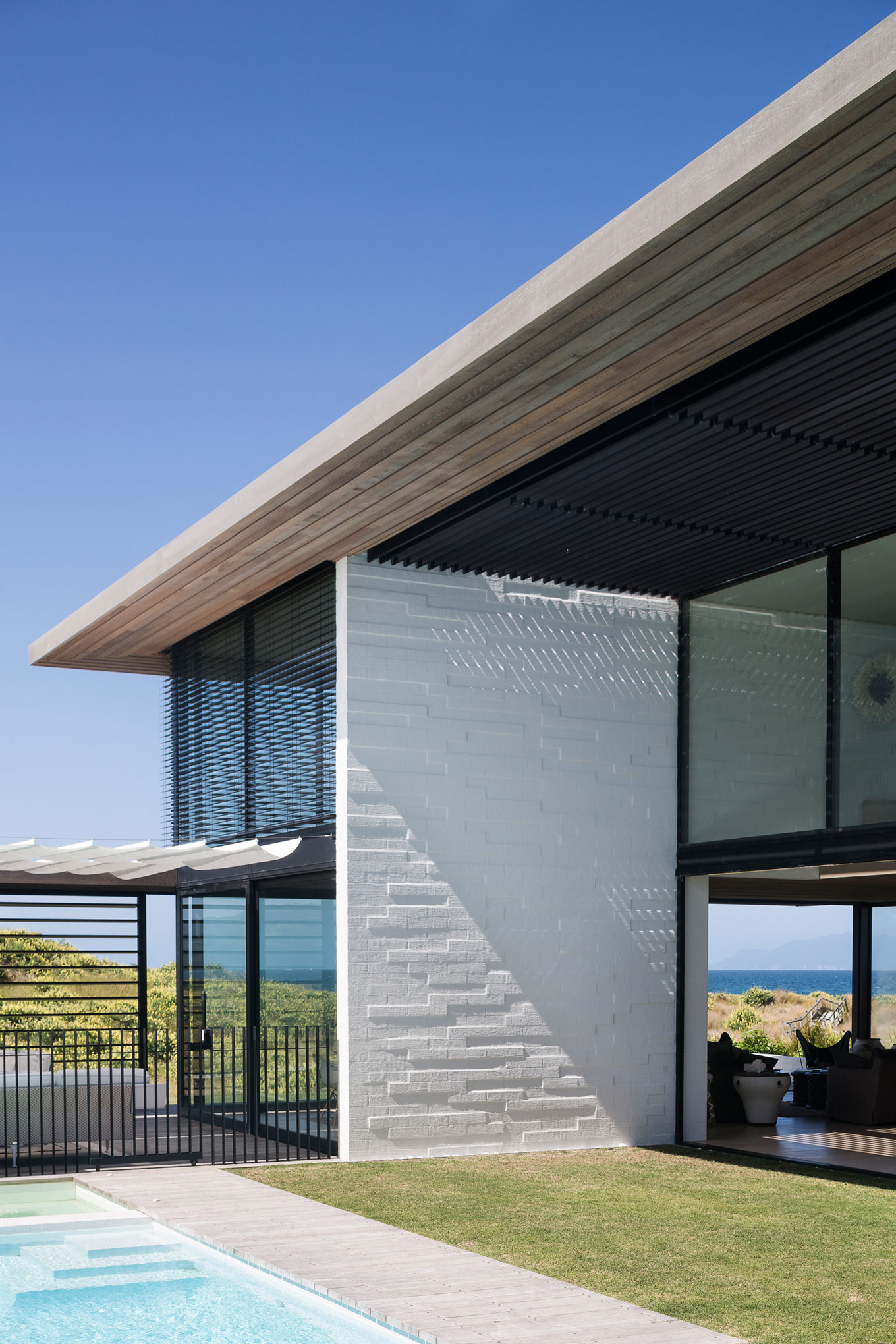 A Contemporary Family Home Greeted by a Double Height Entryway in Omaha, New Zealand by Julian Guthrie (9)