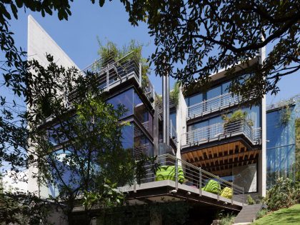 A Contemporary Glass Home Composed of Two Geometric Concrete Volumes in Mexico City