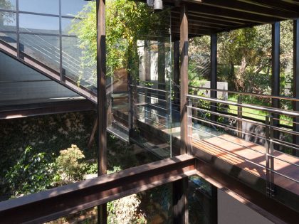 A Contemporary Glass Home Composed of Two Geometric Concrete Volumes in Mexico City by grupoarquitectura (10)