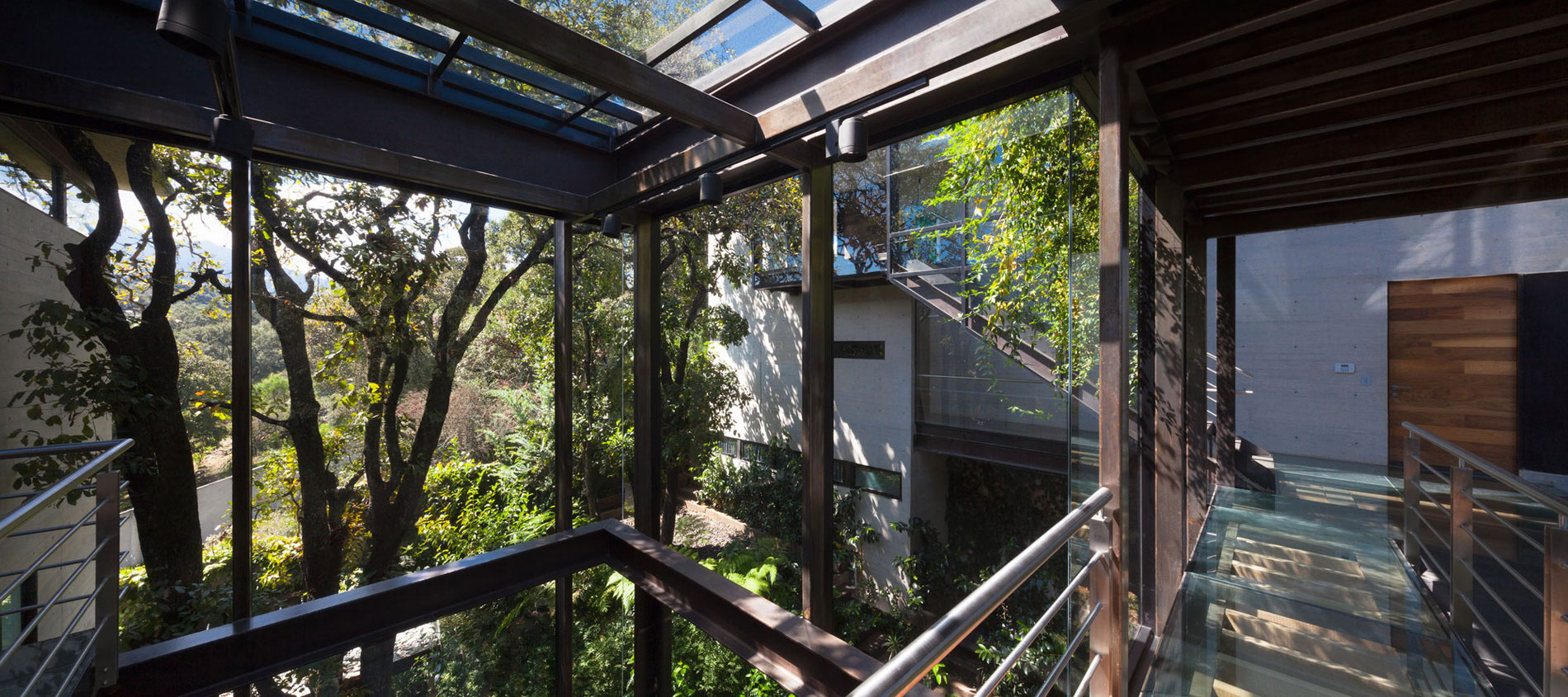 A Contemporary Glass Home Composed of Two Geometric Concrete Volumes in Mexico City by grupoarquitectura (11)