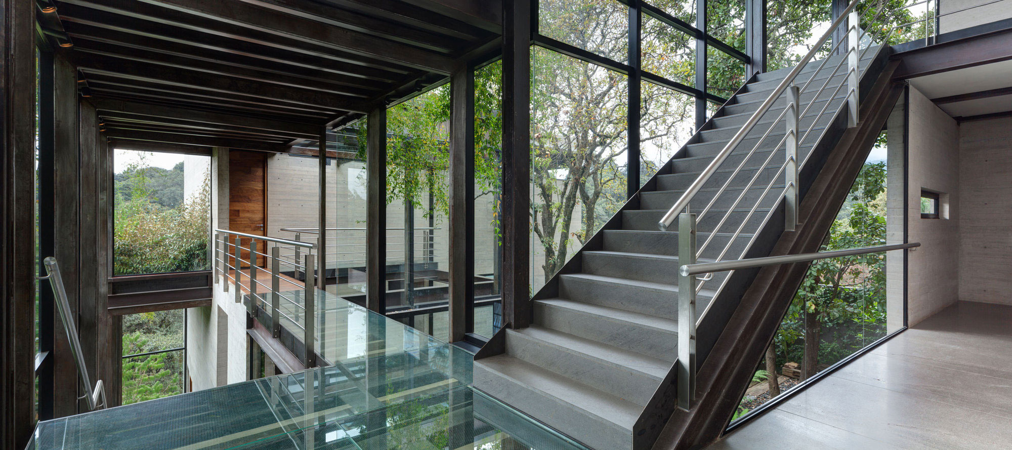 A Contemporary Glass Home Composed of Two Geometric Concrete Volumes in Mexico City by grupoarquitectura (13)