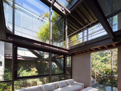 A Contemporary Glass Home Composed of Two Geometric Concrete Volumes in Mexico City by grupoarquitectura (14)