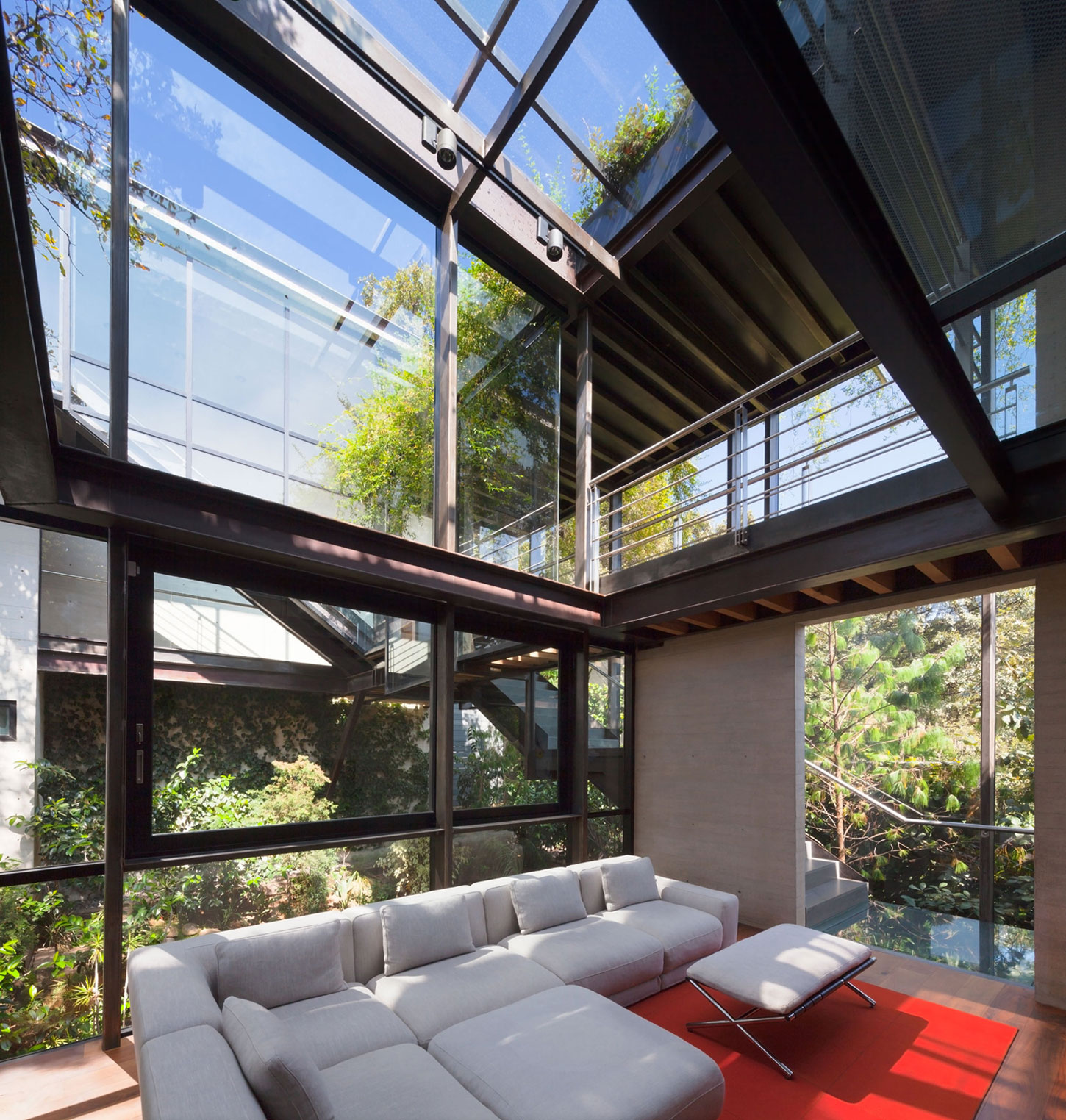 A Contemporary Glass Home Composed of Two Geometric Concrete Volumes in Mexico City by grupoarquitectura (14)