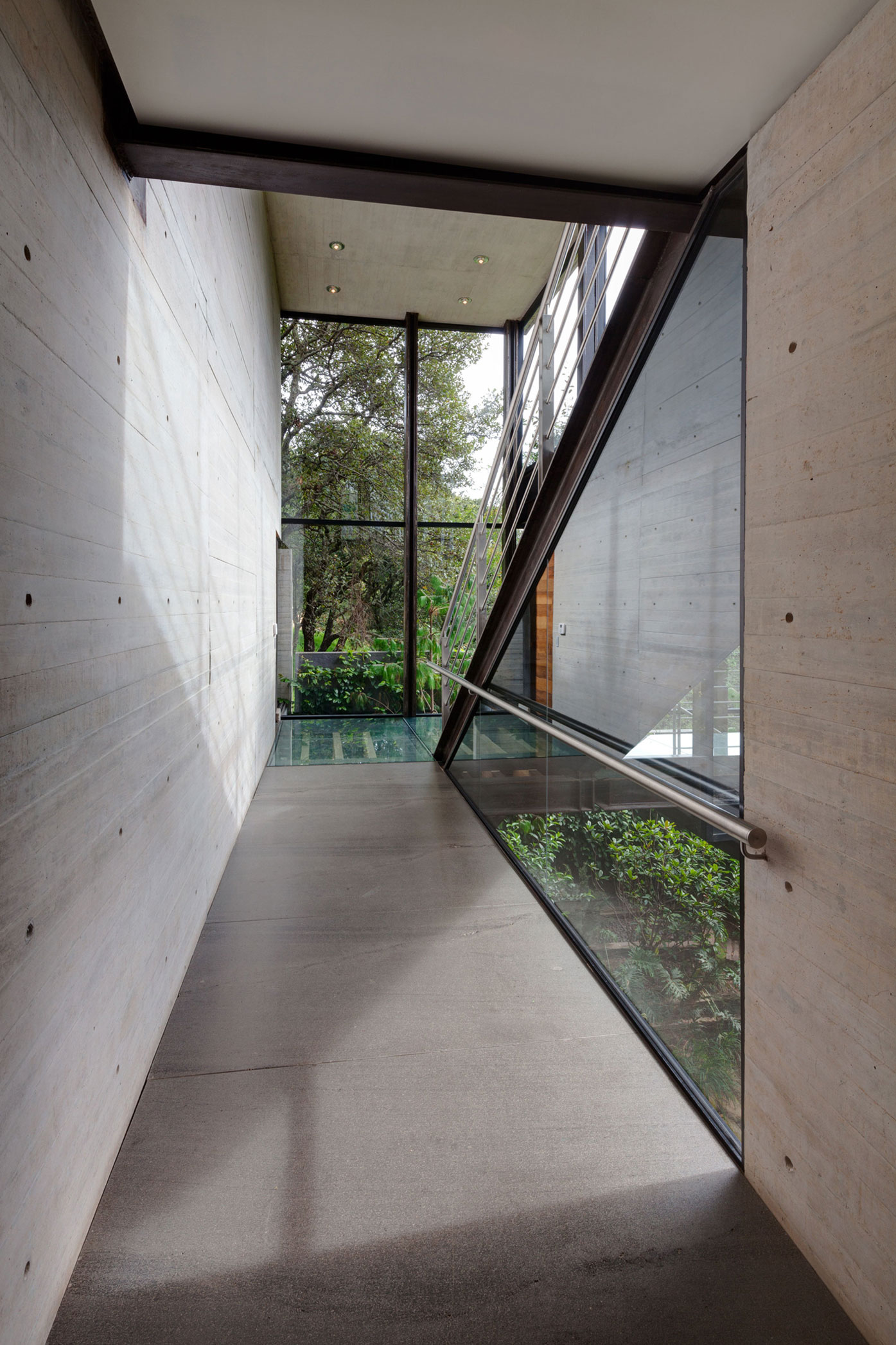 A Contemporary Glass Home Composed of Two Geometric Concrete Volumes in Mexico City by grupoarquitectura (20)