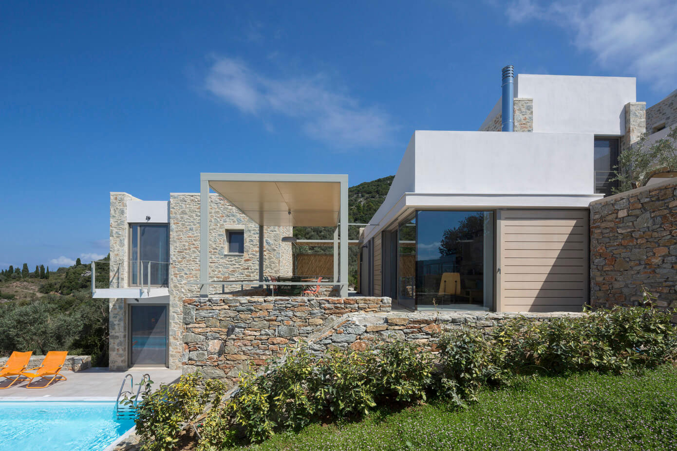 A Spacious Light-Filled Home with Stone Walls and Unique Style on Skiathos, Greece by HHH Architects (1)