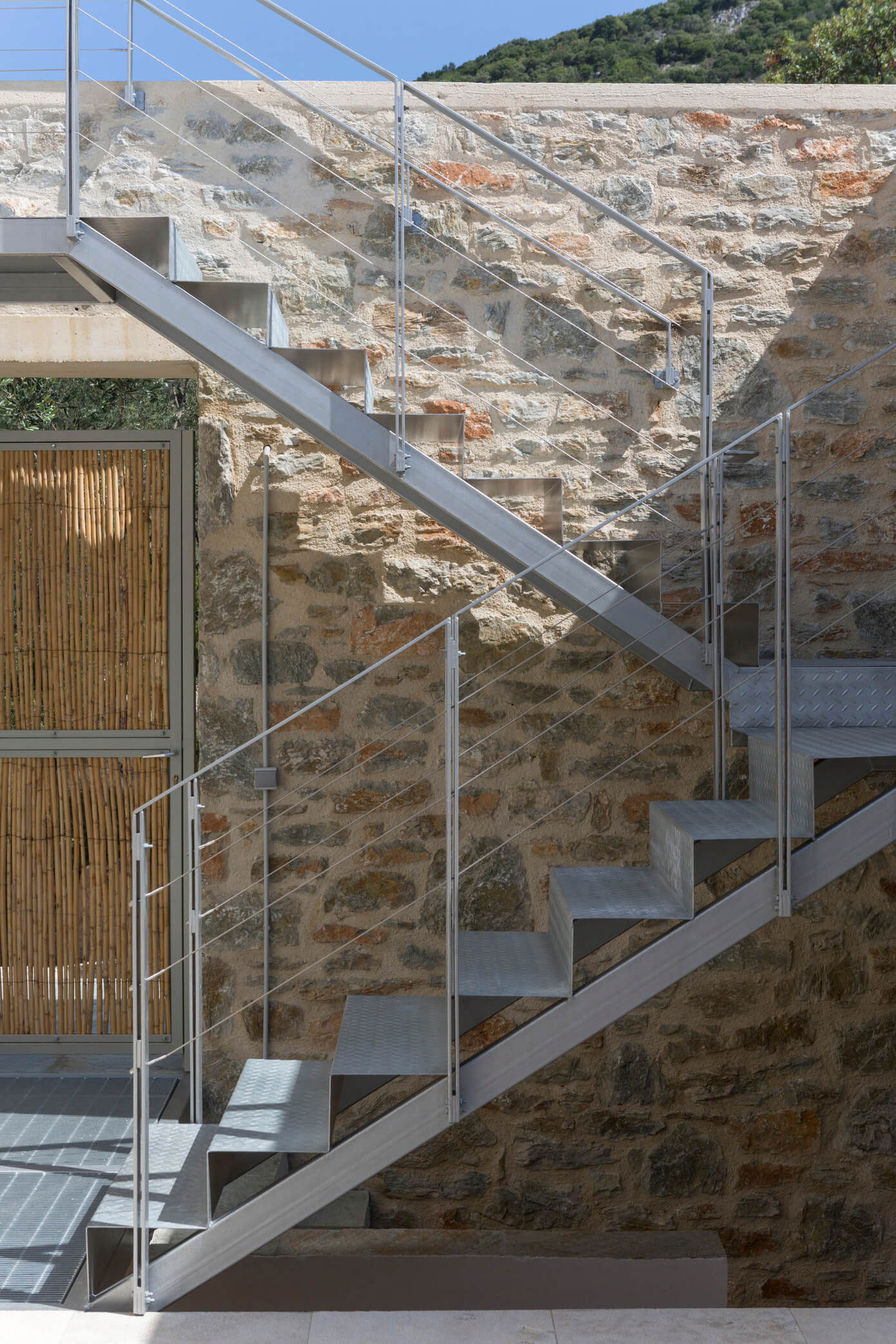 A Spacious Light-Filled Home with Stone Walls and Unique Style on Skiathos, Greece by HHH Architects (11)