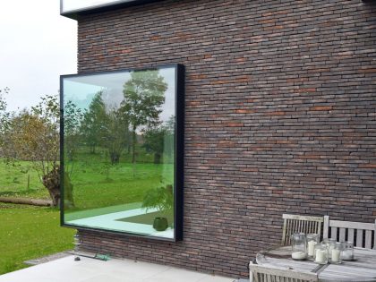 A Luminous House Divided in Two Separate Volumes Surrounded by Vast Green on Aalter, Belgium by Architektuurburo Dirk Hulpia (40)