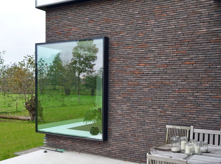 A Luminous House Divided in Two Separate Volumes Surrounded by Vast Green on Aalter, Belgium by Architektuurburo Dirk Hulpia (40)