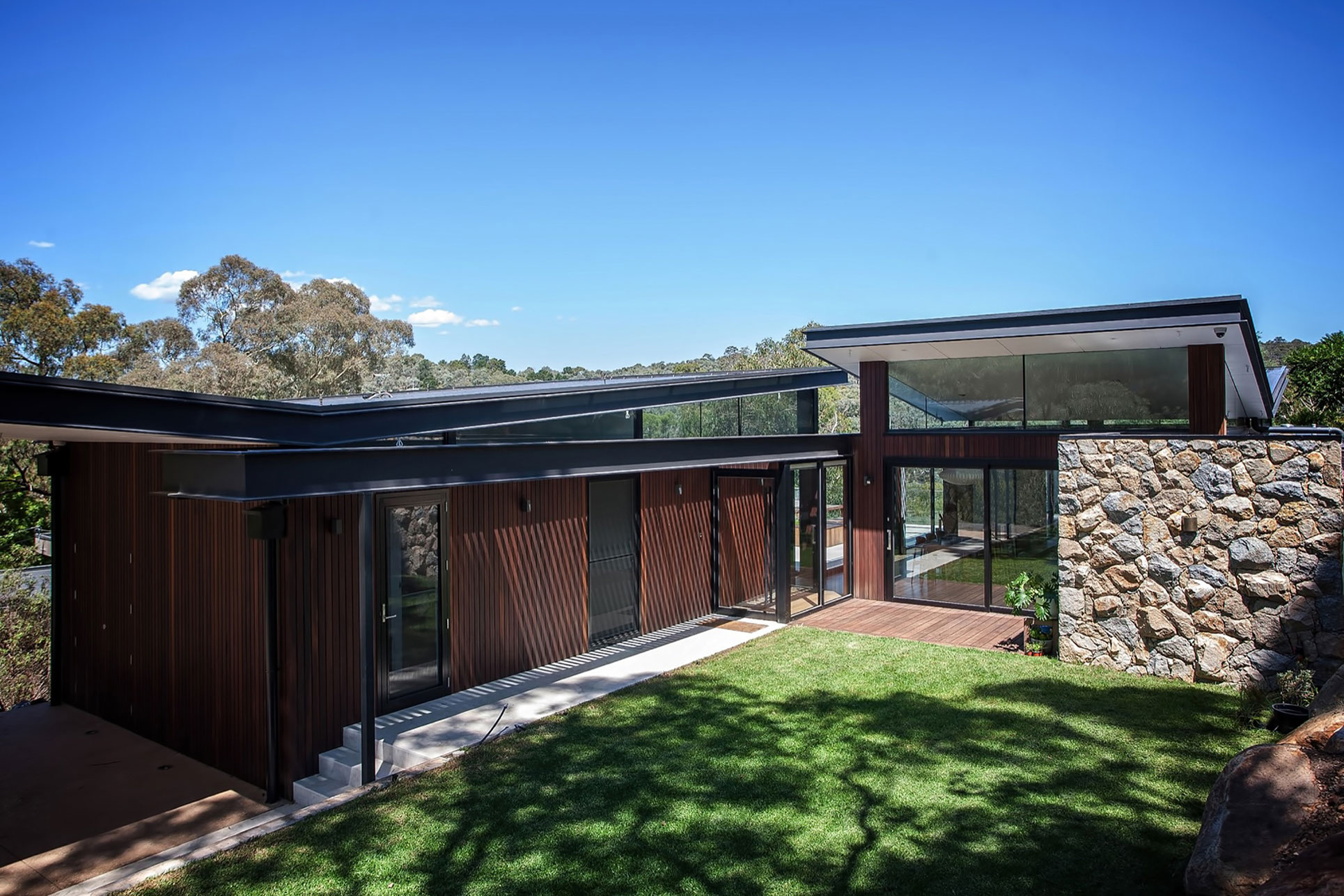 A Spacious Contemporary Home of Stone and Steel Built Above a River in Melbourne, Australia by Alexandra Buchanan Architecture (1)